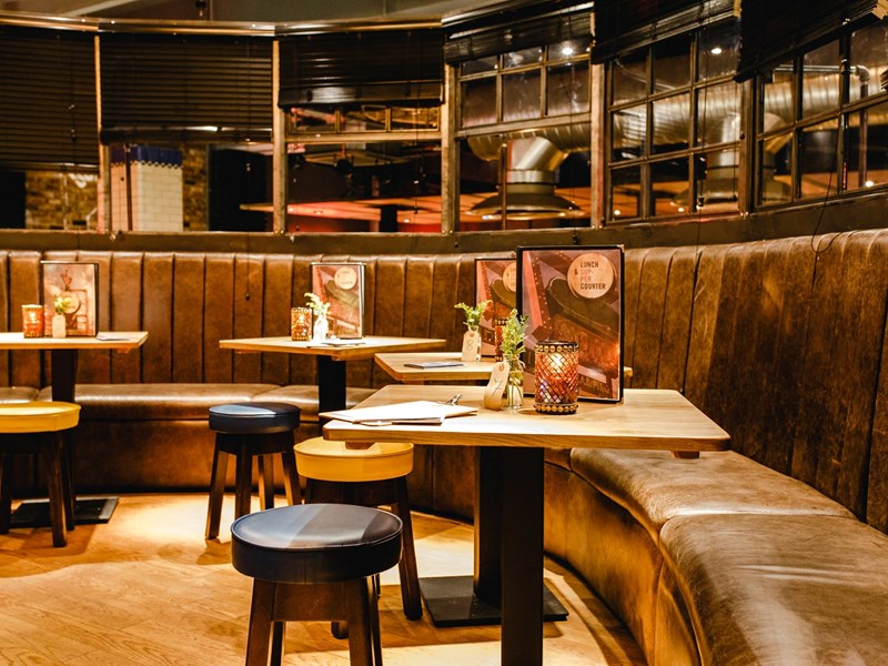 A curved row of tables at Bungalows & Bears.
