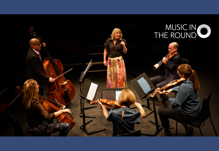 A string quintet performs on stage with a singer.