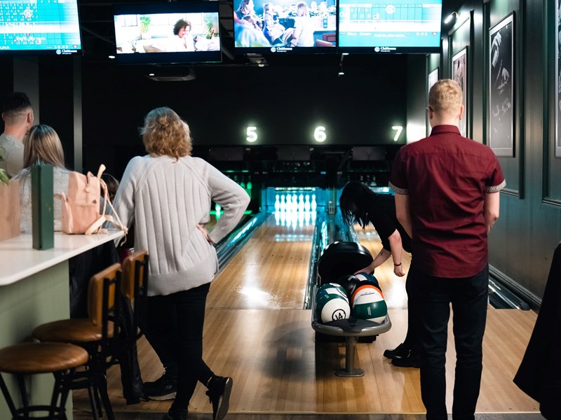People bowling at Clubhouse.