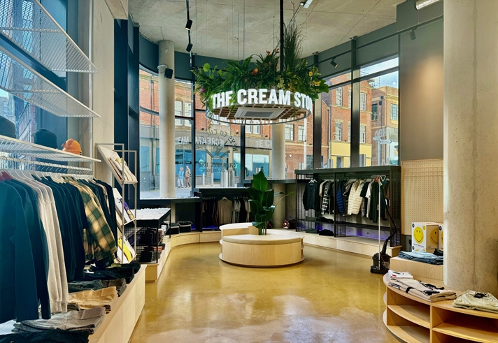 Inside The Cream Store, rails of clothes.