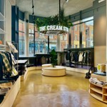 Inside The Cream Store, rails of clothes.