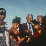 A group of young men posing in the street.