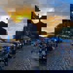 People drinking at dusk outside The Millowners Arms.