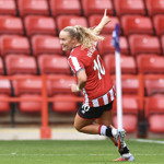 A Sheffield United player celebrates after scoring a goal.
