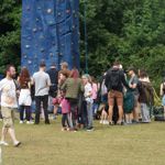 A small crowd gathers around an outdoor mobile climbing wall at a previous years Walkley Festival.
