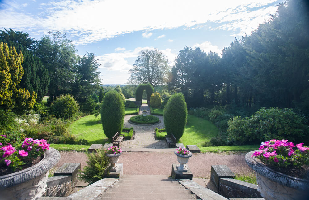 Beautiful gardens at Wortley Hall Bed & Breakfast with manicured lawns and colorful flower beds.