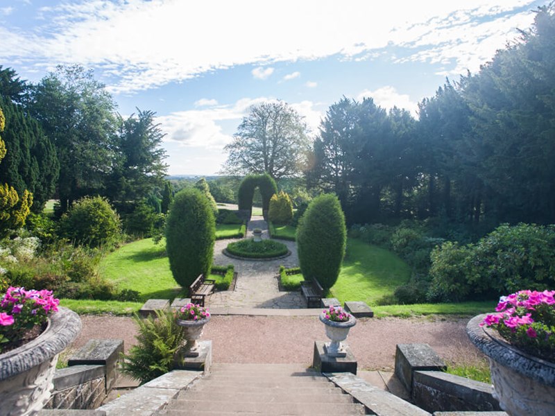 Beautiful gardens at Wortley Hall Bed & Breakfast with manicured lawns and colorful flower beds.