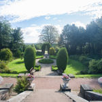 Beautiful gardens at Wortley Hall Bed & Breakfast with manicured lawns and colorful flower beds.