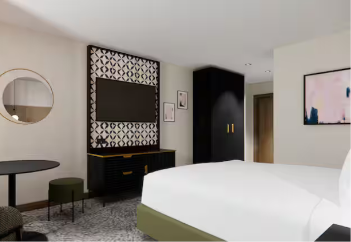 Modern bedroom with TV on wall at the Doubletree by Hilton Sheffield City