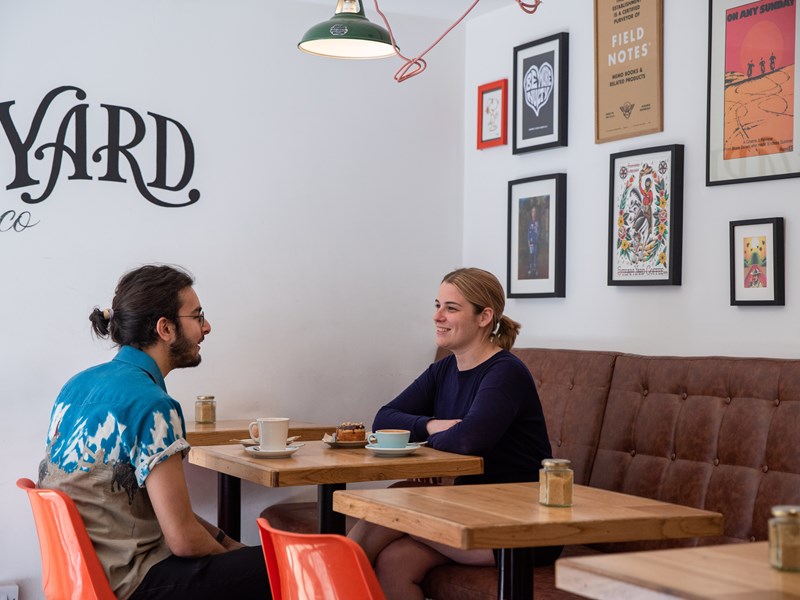 A couple having a coffee at Steam Yard.