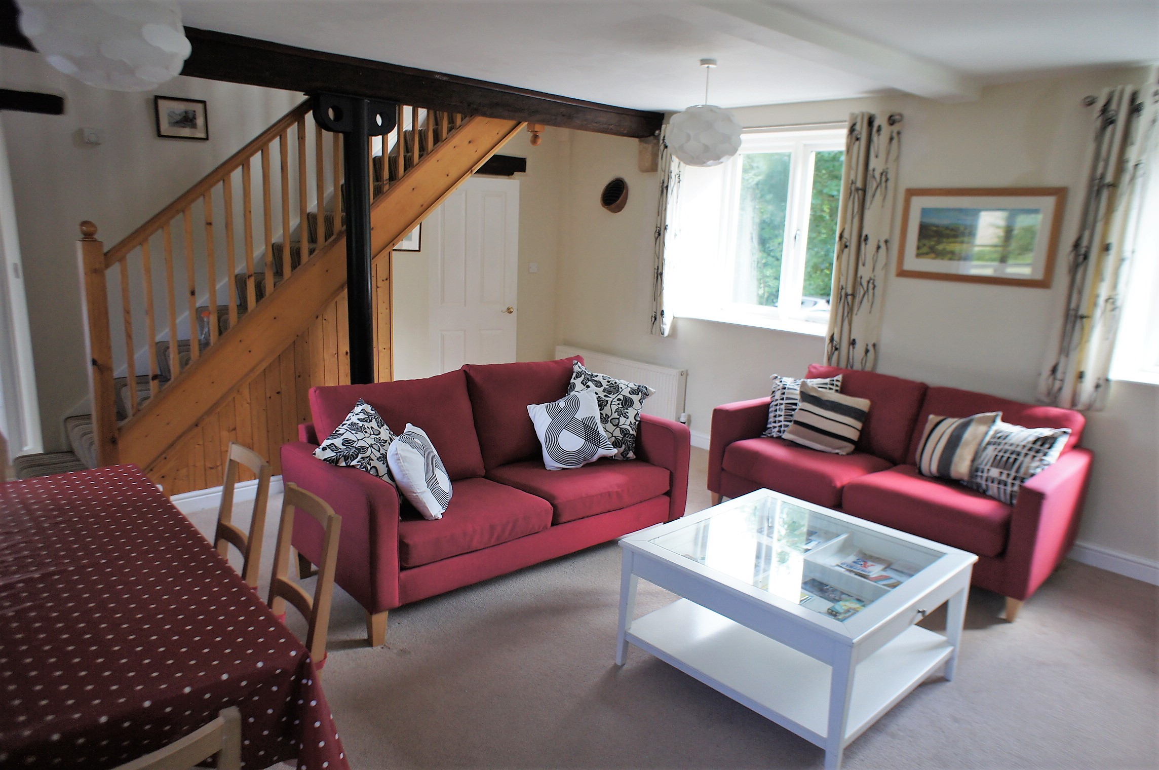 Living room with seating, a coffee table, and décor creating a cozy and welcoming atmosphere.