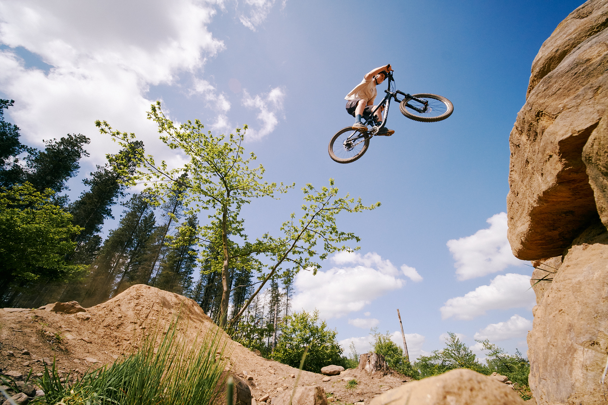 Mountain bike rider make a jump on the trails at Wharnecliffe and Greno Woods