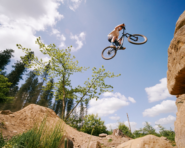 Mountain bike rider make a jump on the trails at Wharnecliffe and Greno Woods