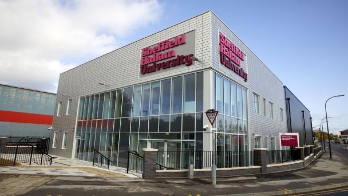 An exterior shot of a building with a sign that reads 'Sheffield Hallam University'.