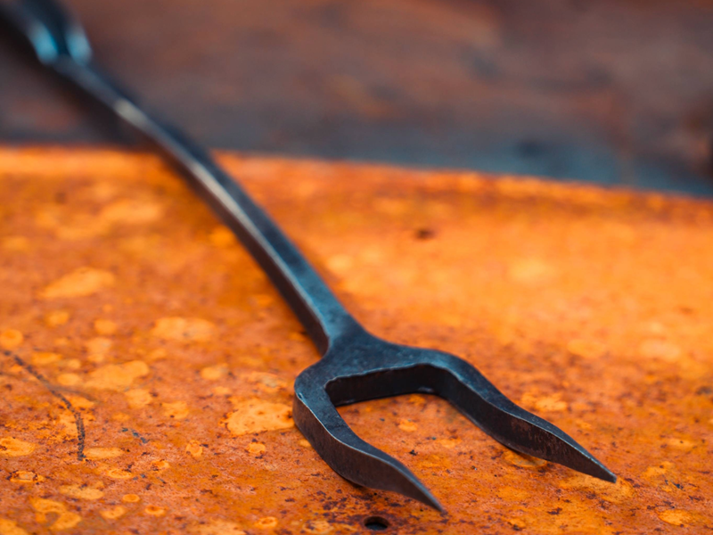 A wrought iron tool.