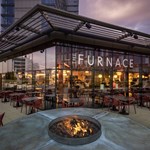 The exterior of The Furnace Bar & Restaurant at dusk