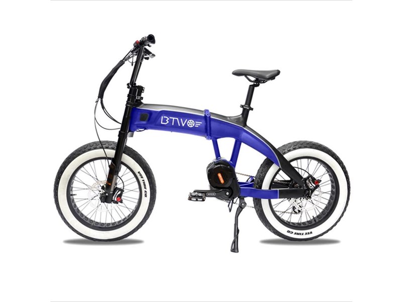 A blue, electric bike with white walled tyres.