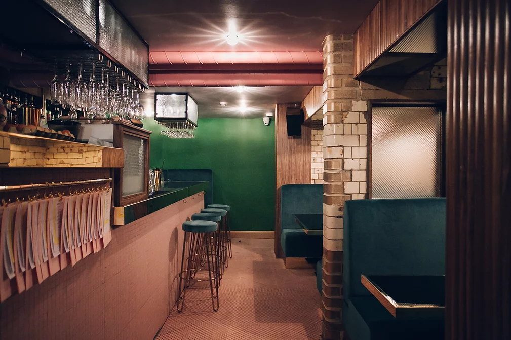 The interior of the bar Public, in Sheffield city centre, showing off the beautiful dark wood and green velvet interior. 