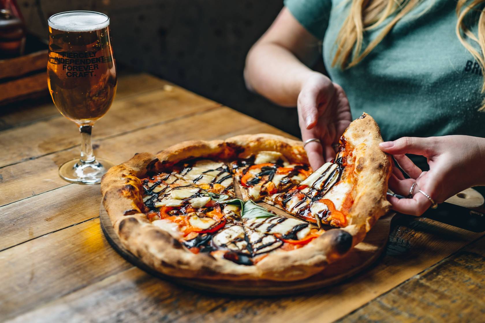 Pizza and a glass of beer.