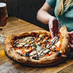 Pizza and a glass of beer.