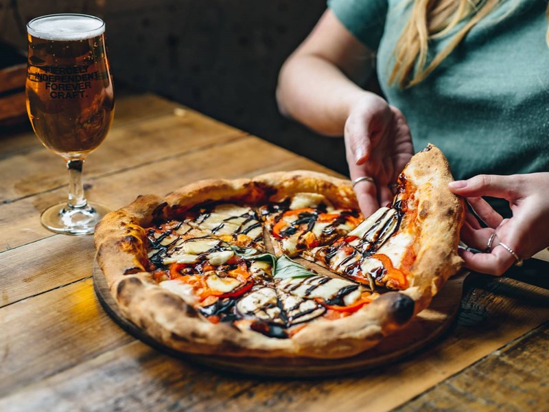 Pizza and a glass of beer.