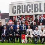 The 2025 World Snooker championship players pose as a group in front of the Crucible Theatre 