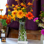 Flower arrangements on display at a horticultural show.