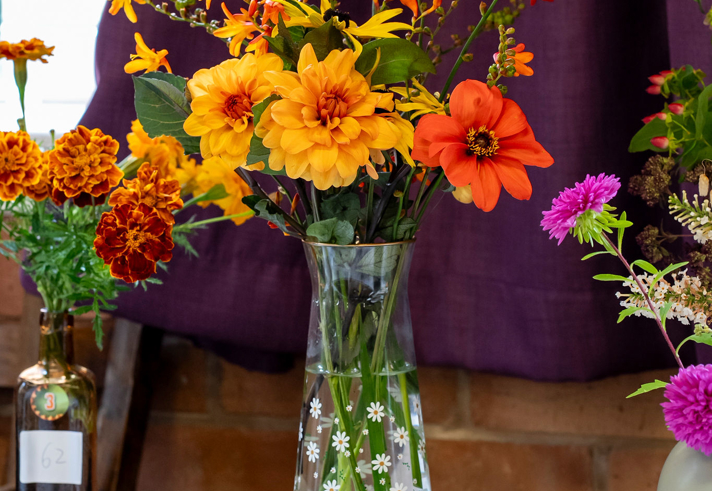 Flower arrangements on display at a horticultural show.