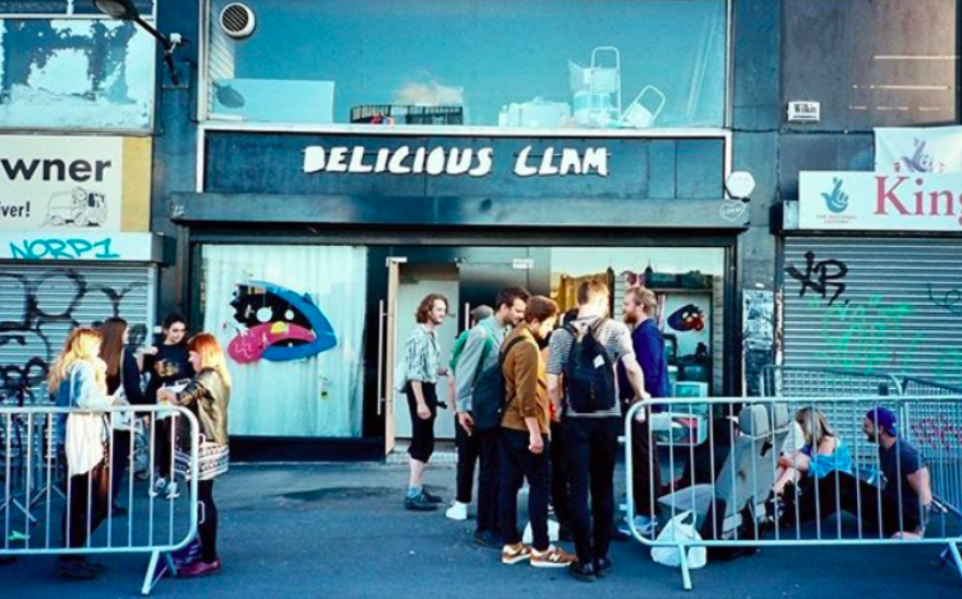 People waiting outside Delicious Clam before a gig.