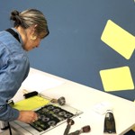 A woman working on a print at the Carousel Print Studio.