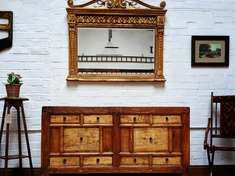 A large sideboard and  large wall mirror on display at The WareHouse.