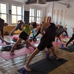 A yoga session taking place at Zagyoga Iyengar Yoga Studio.