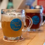 Three pints of beer on a bar top at The Brewery of St Mars of the Desert..