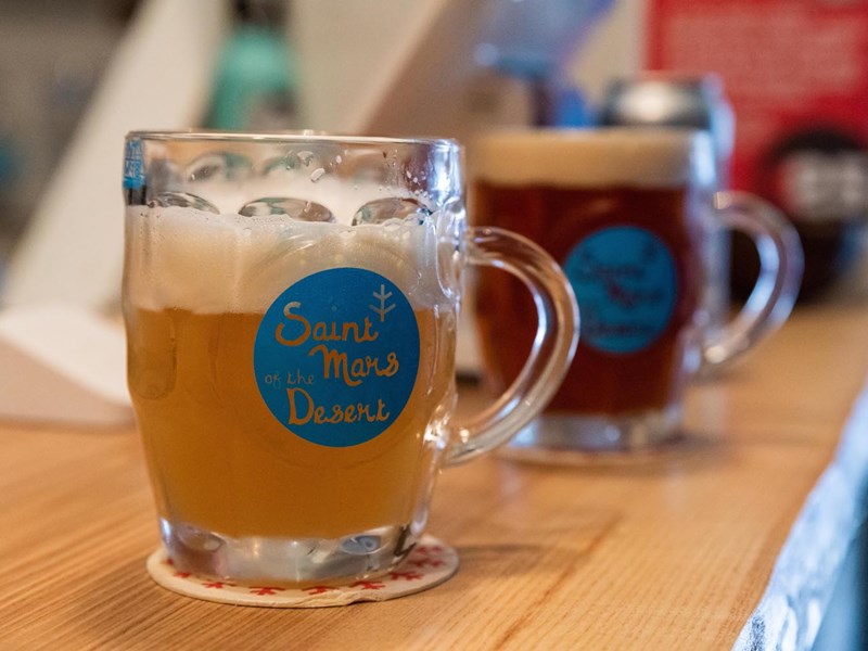 Three pints of beer on a bar top at The Brewery of St Mars of the Desert..