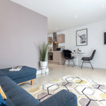 Living room at K Space @ The Point with sofa and modern décor.