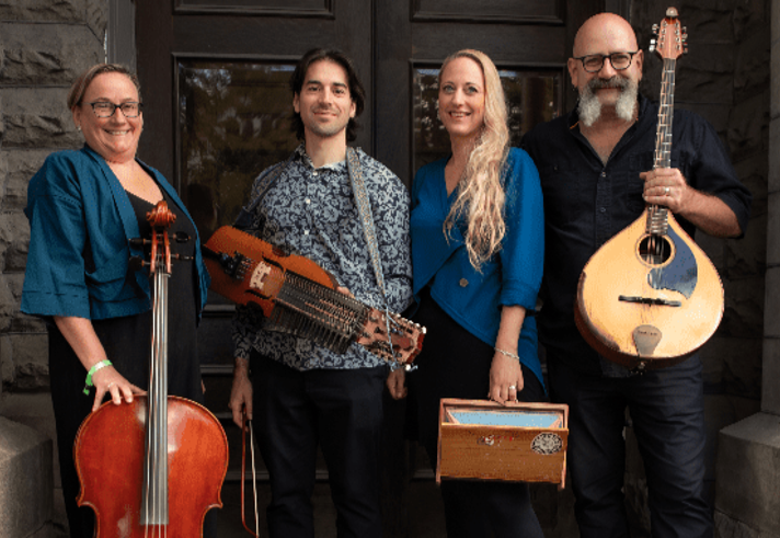 A photo of a four piece folk band, holding their instruments.