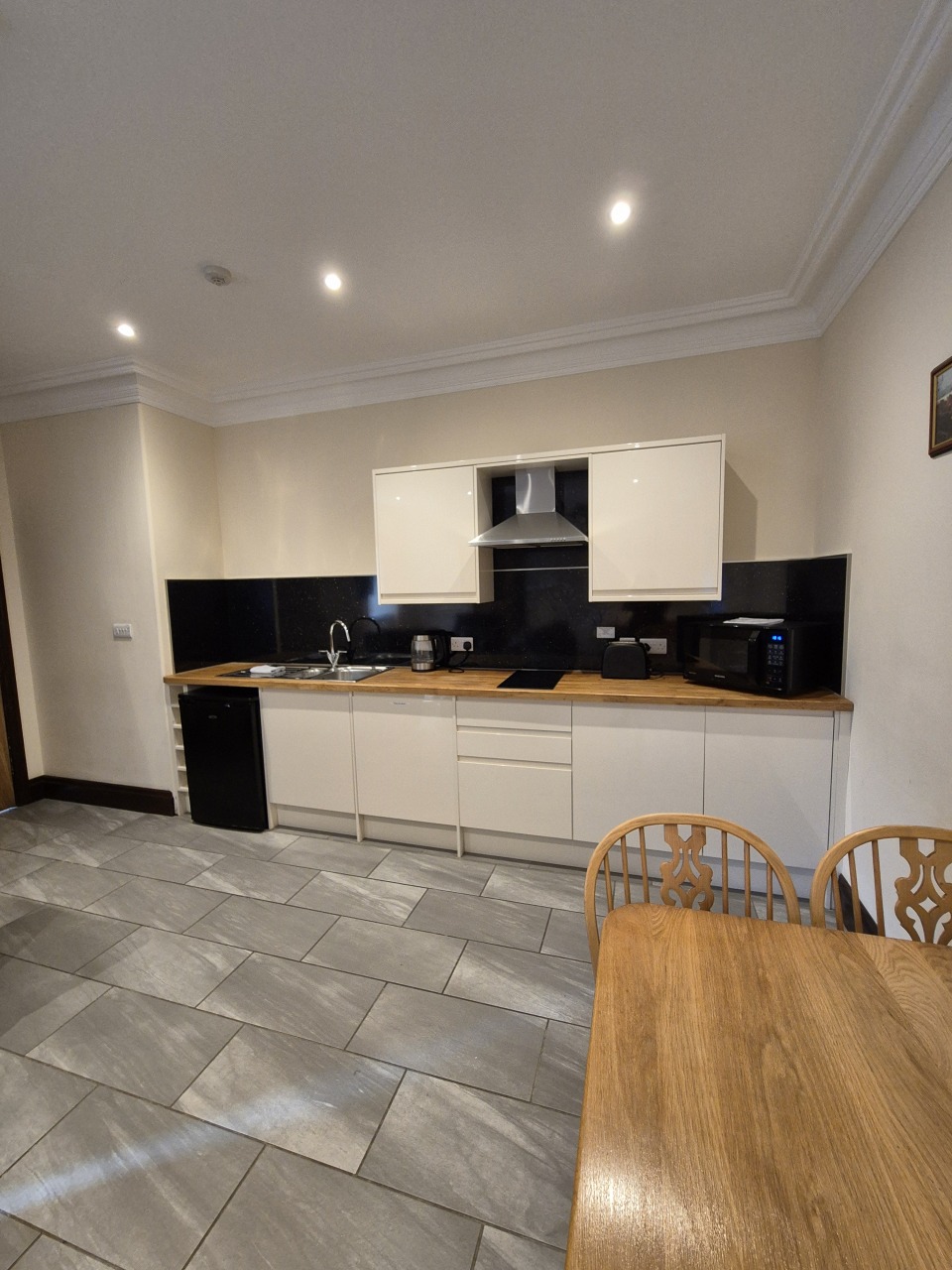 Padley Farm - compact kitchen with appliances and storage units