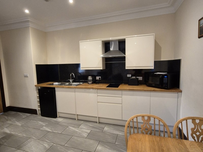 Padley Farm - compact kitchen with appliances and storage units