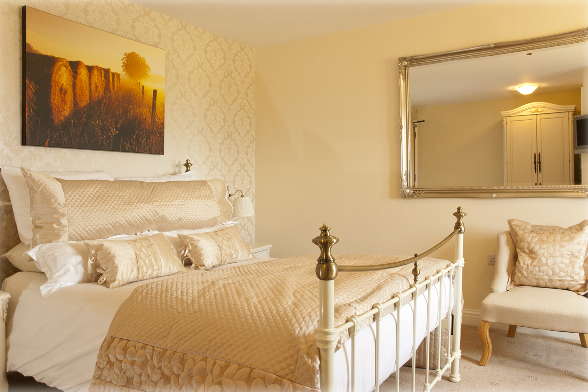 A double bed in a nicely decorated room.