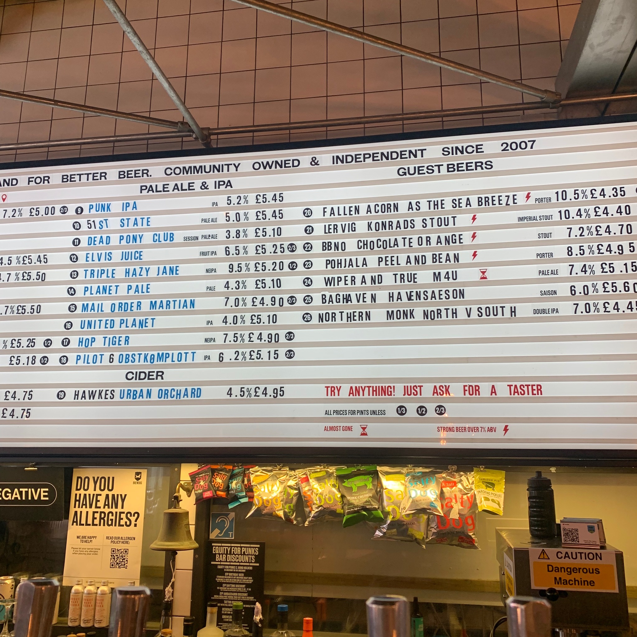 A huge board with beers listed alongside their prices.