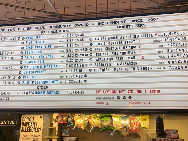 A huge board with beers listed alongside their prices.