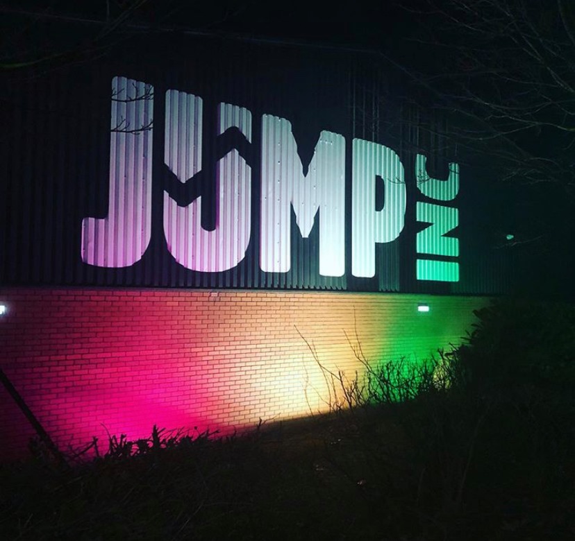 The outside wall at Jump Inc with their logo painted on the wall.