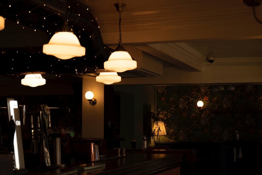 The interior of a dimly lit bar.