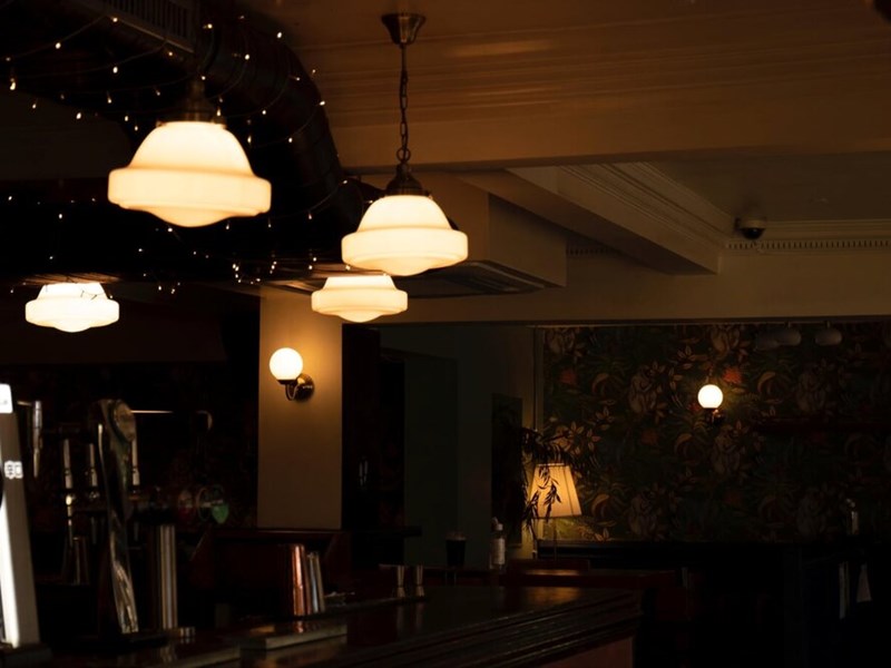 The interior of a dimly lit bar.