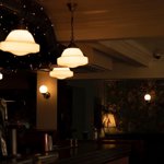 The interior of a dimly lit bar.