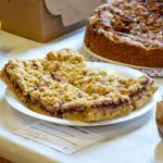 Cakes, flapjacks and other baked goods on display at a horticultural show.
