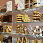A glass cabinet full of cookies, brownies and other treats at Sorrel's Cocoa Bakery