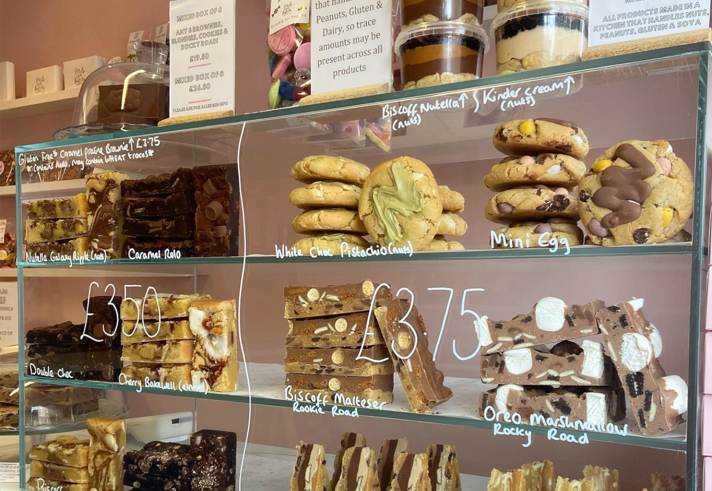A glass cabinet full of cookies, brownies and other treats at Sorrel's Cocoa Bakery