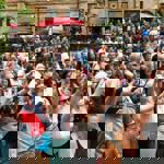 A crowd of people enjoying live music at Leopold Square.