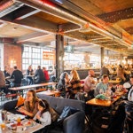 Inside Cutlery Works, filled with customers dining.